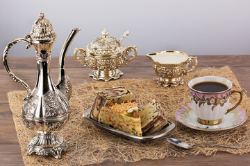 delicious oriental sweets and black coffee with milk