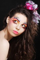Fototapeta premium Beautiful lady with artistic make-up.