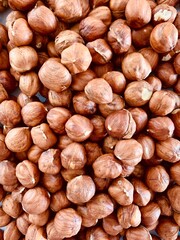 Hazelnut Background. Heap of peeled hazelnuts.