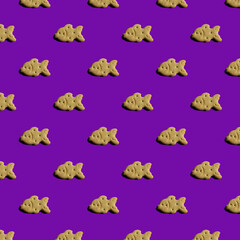 pattern of cookies in the shape of a fish on a white background

