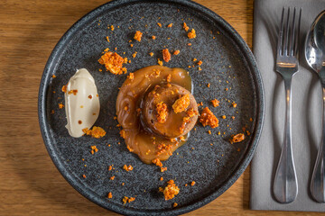 Sticky toffee pudding with cream and honeycomb