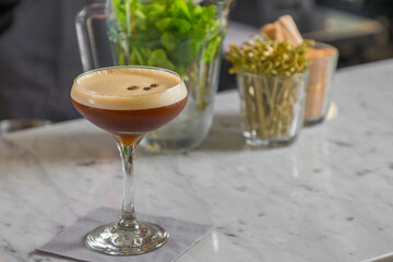 Iced coffee cocktail with irish whiskey prepared on bar