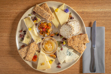 Cheese platter with relish, chutney and crackers