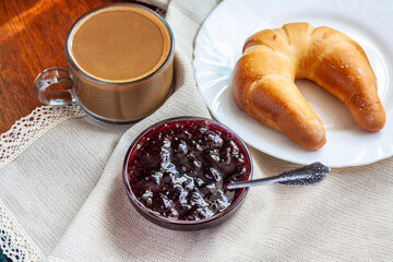 Sweet Breakfast, coffee with milk, bagel and jam