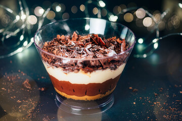 Xmas dessert. Family Pot of Irresistible Layered Billionaires Dessert made from chocolate and caramel mousse layers, chocolate brownie bites and crunchy chocolate honeycomb pieces.
