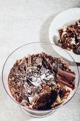 Xmas dessert. Family Pot of Irresistible Layered Billionaires Dessert made from chocolate and caramel mousse layers, chocolate brownie bites and crunchy chocolate honeycomb pieces.