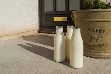 Bottles of fresh milk delivered to a doorstep