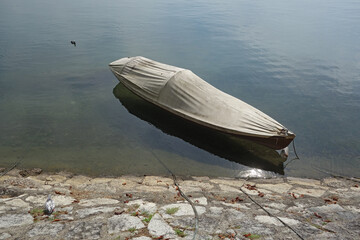boat anchored at lake bank
