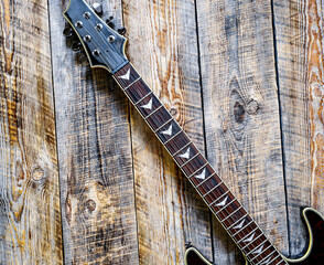 Electric guitar body on wooden background vintage look