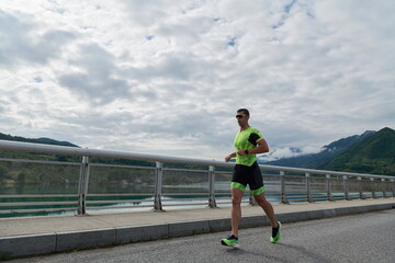 triathlon athlete running on street