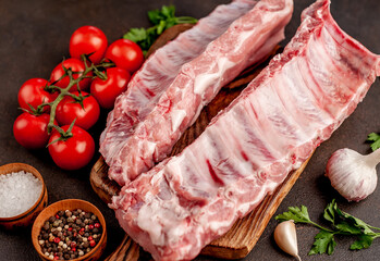 
raw pork ribs on a stone background