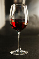 wine glass on a dark background. Glass with red wine