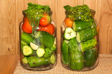 Cucumbers and tomatoes in a can for canning