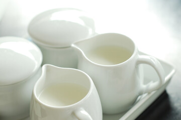 White Cup of Milk on a light Background