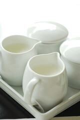 White Cup of Milk on a light Background