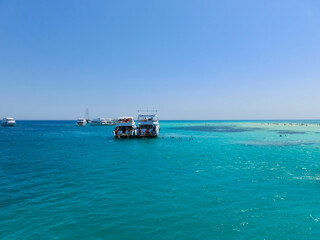 Obraz premium People at beautiful place in the Red sea - White Island.