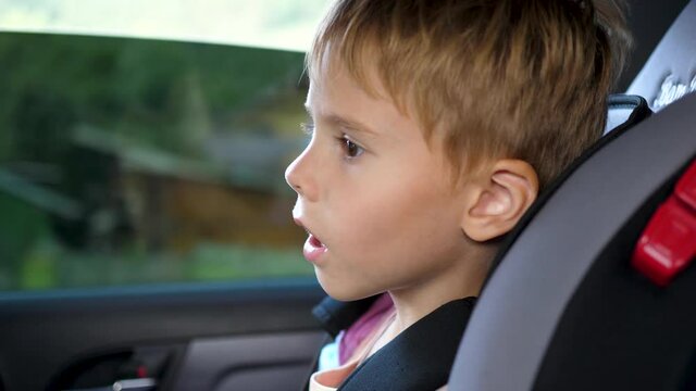 The child goes in a car seat in the car. Family trip