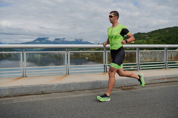 triathlon athlete running on street