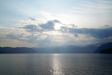 Fototapeta premium Sunrise over the foggy Altai lake 