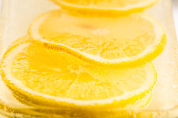 Fototapeta na wymiar Slices of lemon in water