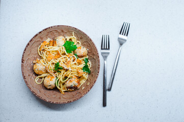 tasty italian homemade pasta with chanterelles, turkey meat balls and creamy sauce