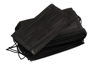 Black medical protective disposable mask kit stack of 50 pieces on white background isolated. The concept of protection against flu, smog, virus, coronavirus, allergy. Nobody.