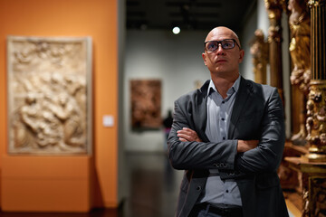 Man exploring medieval expositions in museum