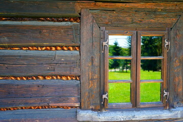 The window of an old wooden hut.