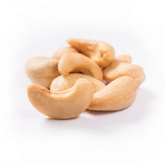 Composition of salted and roasted cashews on a white background