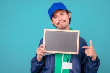 Asian Delivery Guy Showing Empty White Poster, Blue Background, Mockup