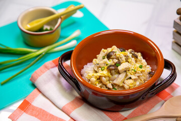 Egg fried rice with mushrooms, children's food on the table, set up appetizing.