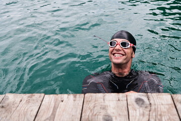 triathlete swimmer portrait wearing wetsuit on training