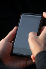 Blank mobile phone on hands