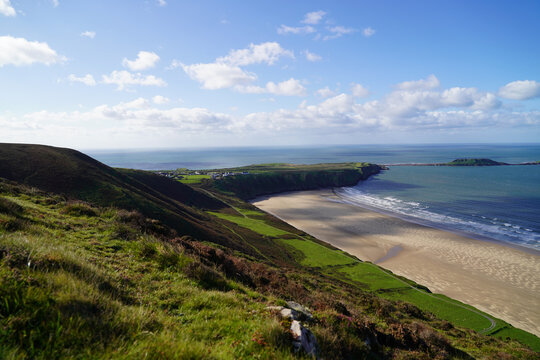Gower Peninsular Rhossilli Bay Panoramic with Green Hills surrounding the Sandy Bay - Green Welsh Hillsides