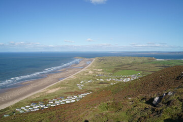Gower Peninsular Rhossilli Bay Panoramic with Green Hills surrounding the Sandy Bay - Green Welsh Hillsides