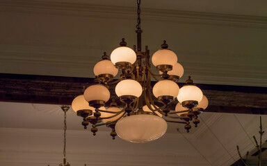 White chandelier hanging on the ceiling