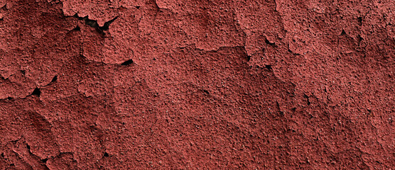 Red cracked wall surface. Dark texture