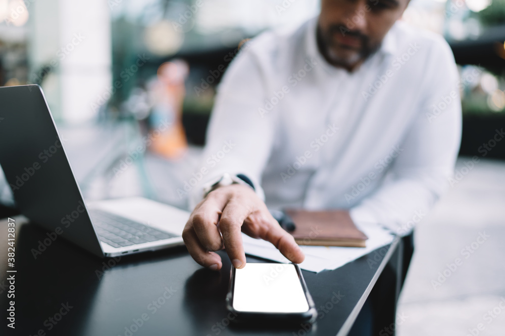 Poster blurred businessman checking received notification on mockup cellphone gadget connecting to 4g wirel