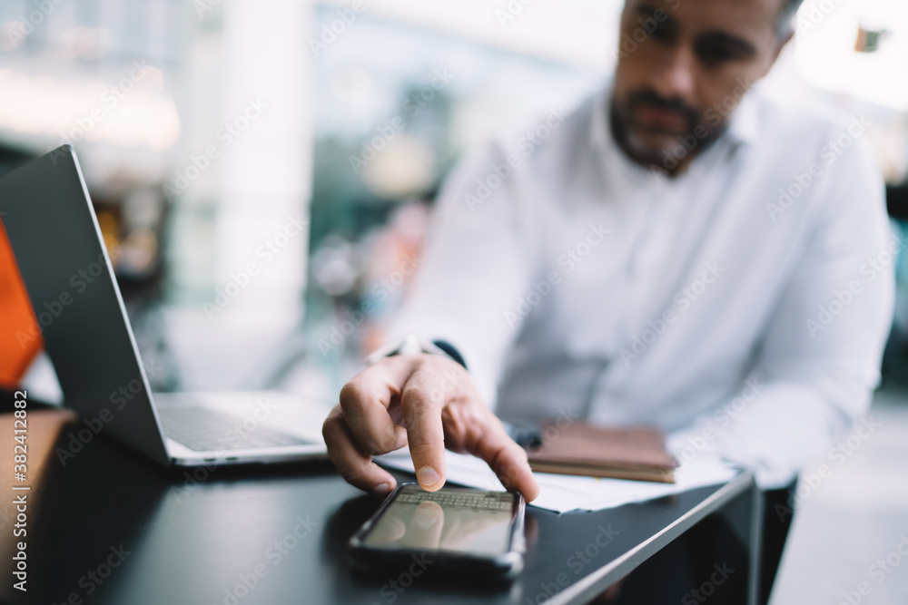 Aufkleber blurred businessman using smartphone keyboard for texting informative message and sending sms during