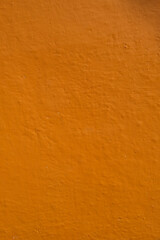 Orange painted wall with a lot of relief