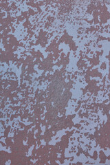 weathered red wall with white spots