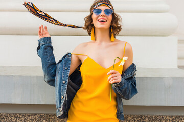 beautiful sexy stylish woman in yellow stylish dress wearing denim jacket, trendy outfit, spring summer fashion trend, sunny, blue sunglasses, street fashion, hipster style, fashionable accessories