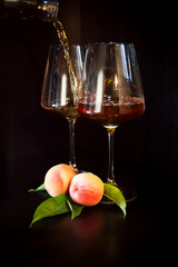 Peach and glass on a black background
