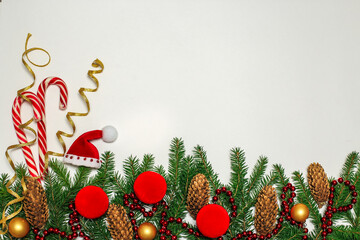 Christmas composition. red decorations on a white wall. winter, new year's concept. flat layout,...