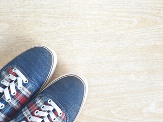 Vintage blue shoes on wood background