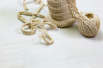 Background copy space handmade crochet handicraft from white cotton yarn.
