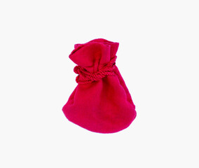 Small red velvet pouch on white background