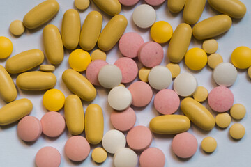 Fototapeta na wymiar Different pills on color background, flat lay. COVID-19 (coronavirus) drugs