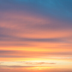 Orange and blue clouds at sunrise