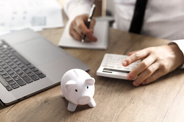 Fototapeta na wymiar white piggy bank on wooden table. money savings, cash deposit concept